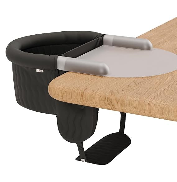 Lalo Hook-On Chair clamped to a wooden table with silicone tray and footrest